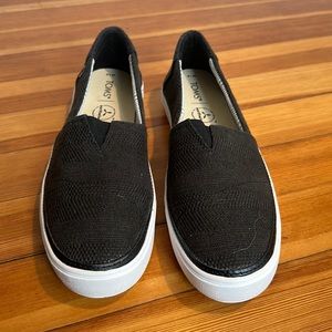 Tom’s black slip on shoes